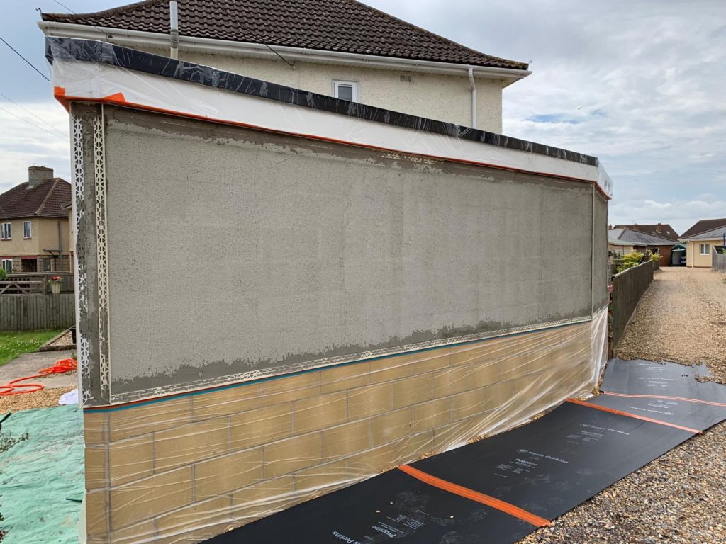 Spray rendered garage in Melksham