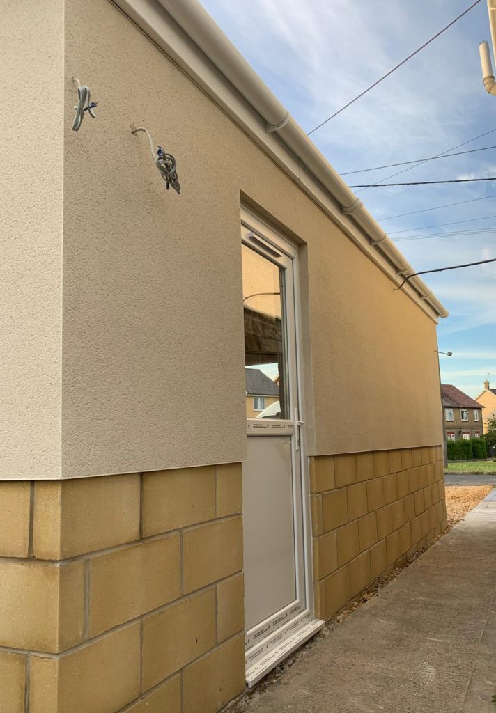 Spray rendered garage in Melksham