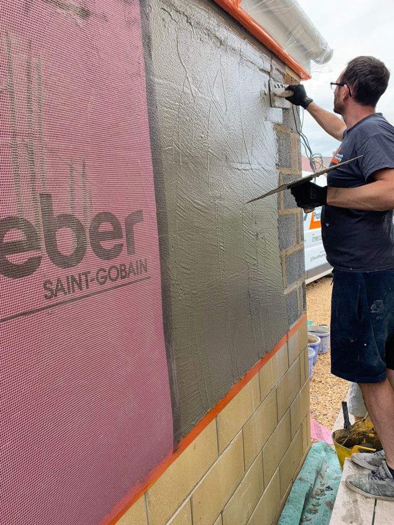 Spray rendered garage in Melksham