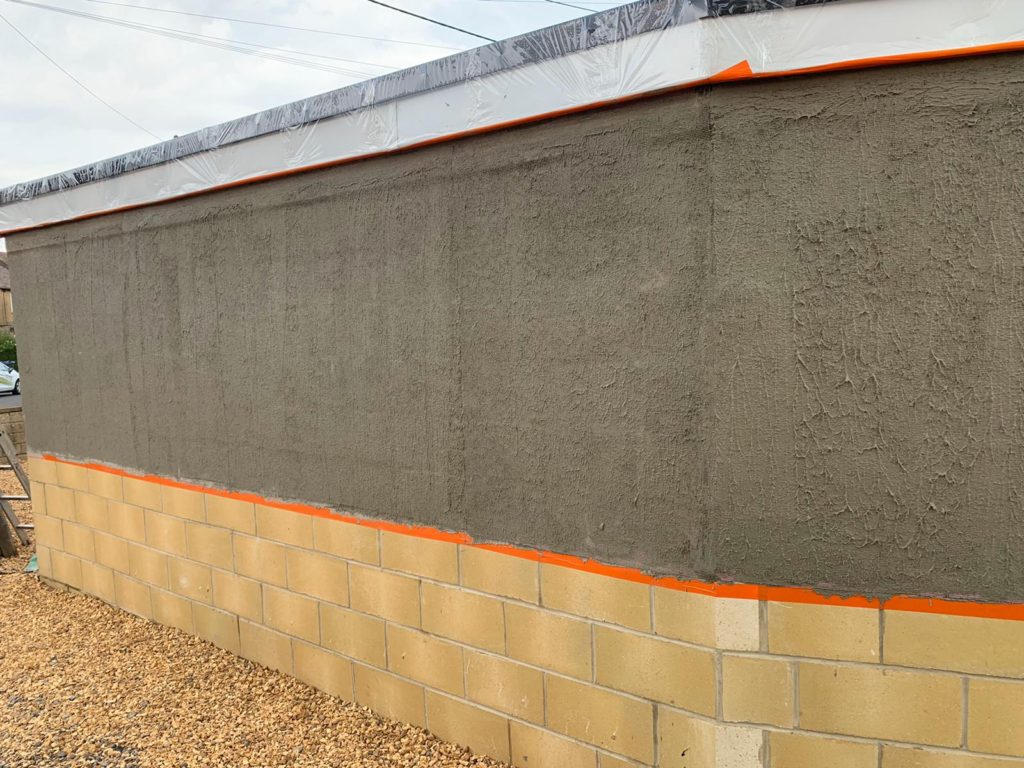 Spray rendered garage in Melksham