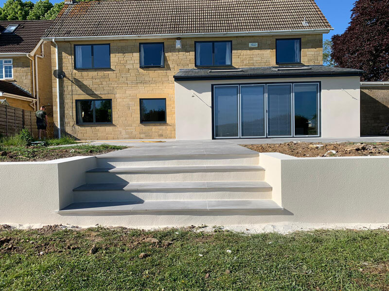 Spray render on a house in Holt in Silicone K1 K-Rend in White